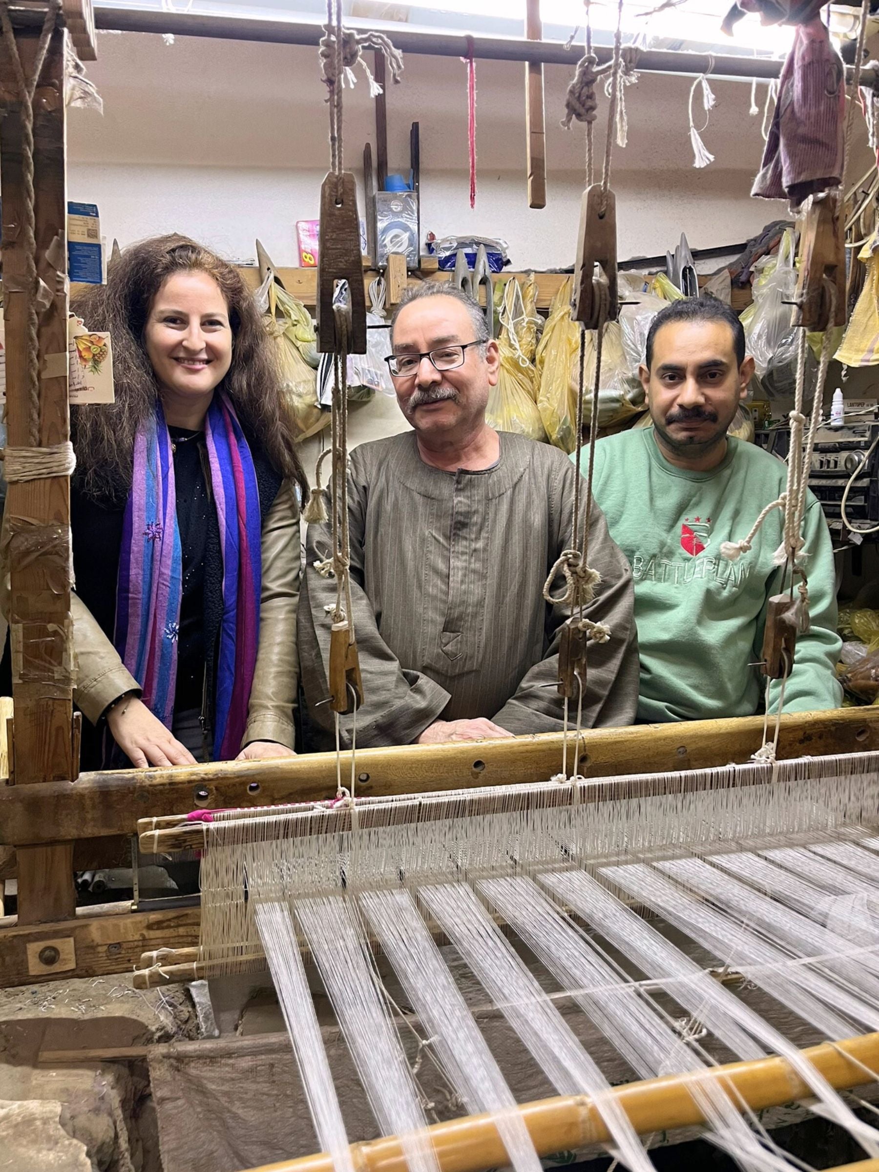 The creator of Nilazur with our skilled weavers, united by a passion for handmade craftsmanship and natural fibers.
